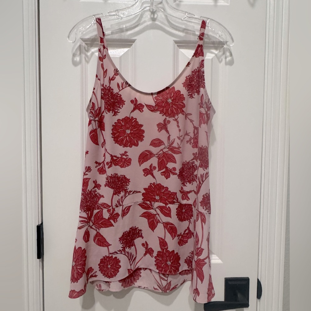 Lightweight flow tank. Adjustable straps. Slight peplum.